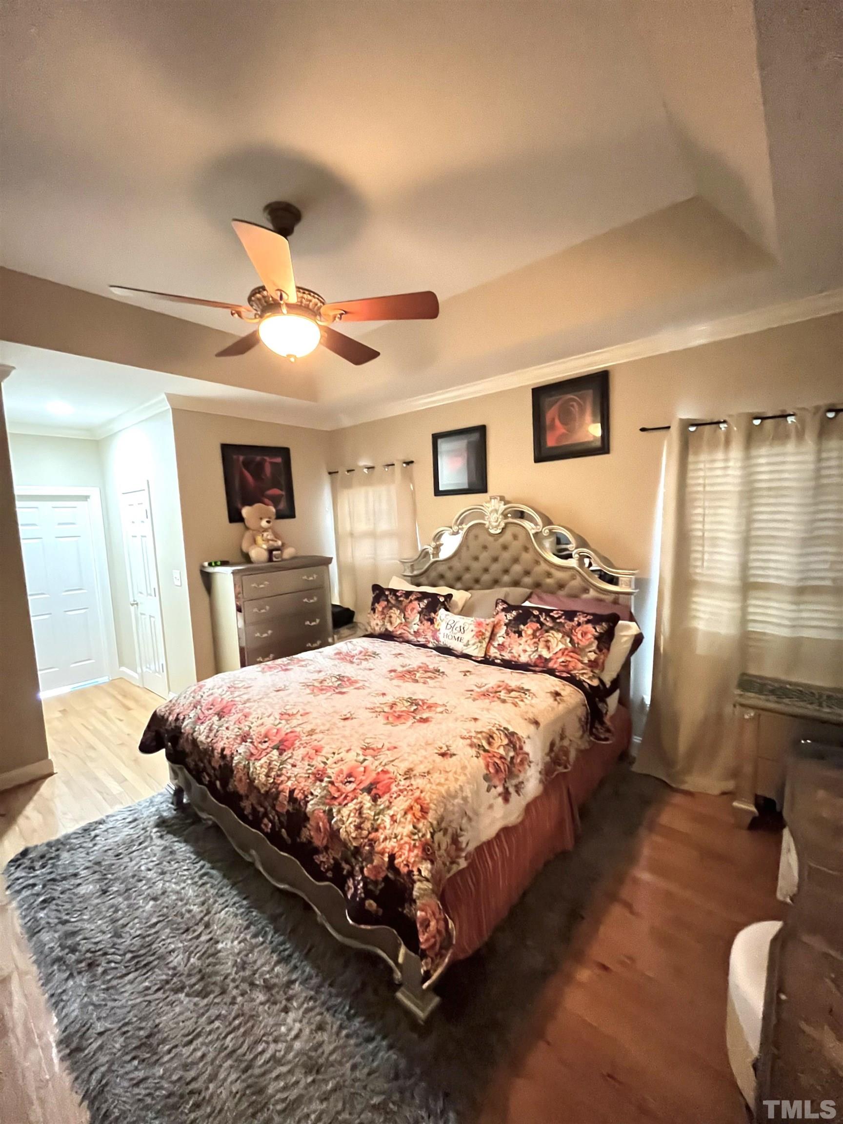 3098 Creek Point Road Haw River, NC 27258 - Photo 18 of 21 a spacious bedroom with a large bed and a dresser