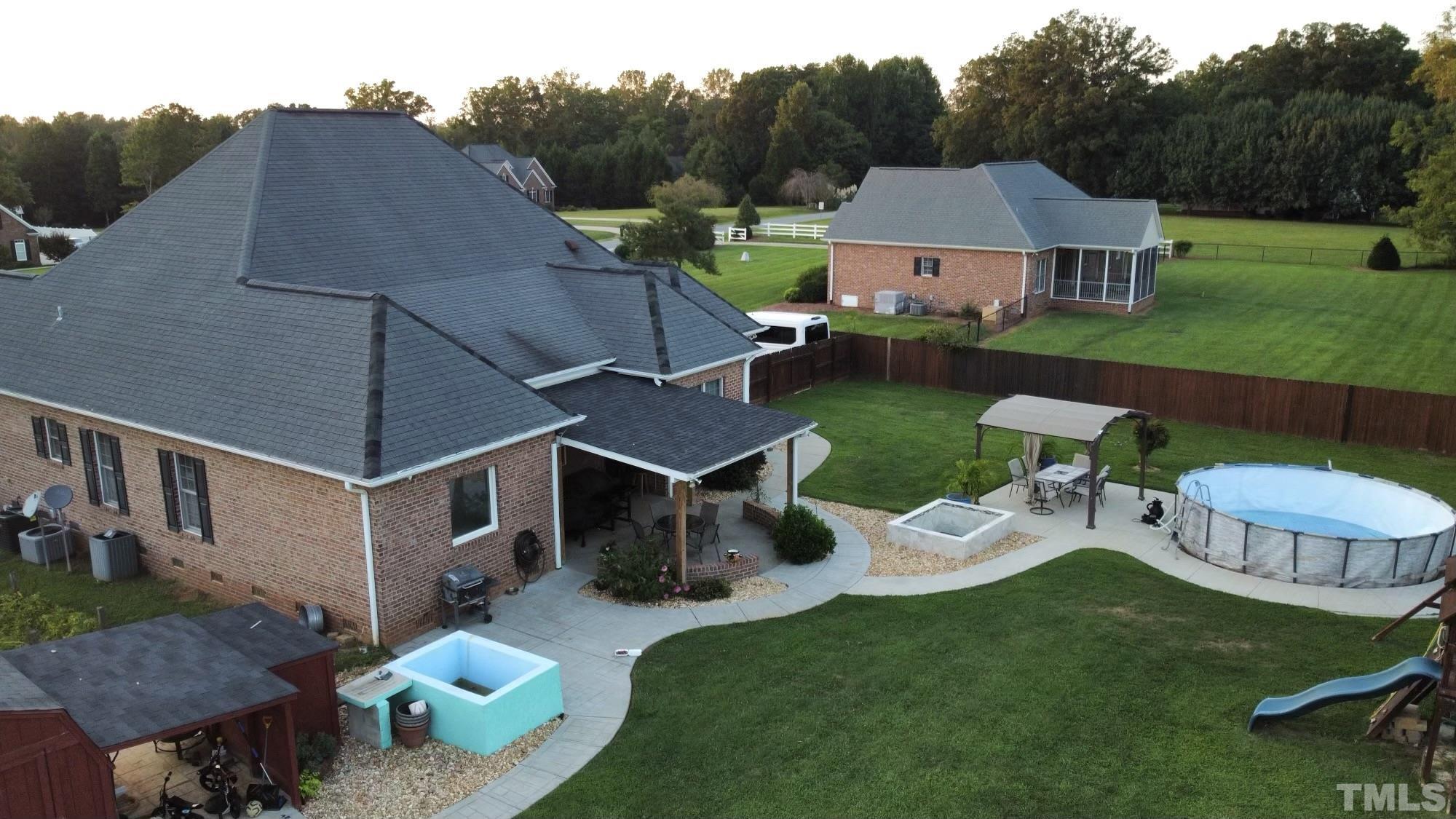 3098 Creek Point Road Haw River, NC 27258 - Photo 3 of 21 an aerial view of a house with garden space and street view