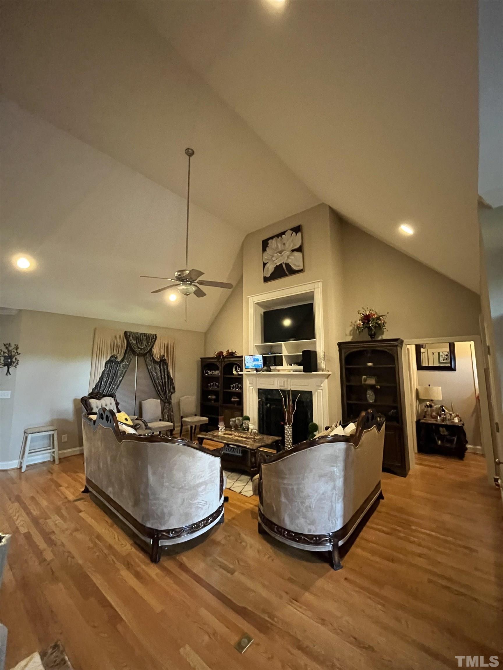 3098 Creek Point Road Haw River, NC 27258 - Photo 10 of 21 a living room with furniture a flat screen tv and a fireplace
