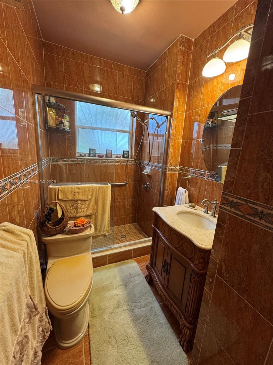 322 Southwest 31st Court Miami, FL 33135 - Photo 12 of 21 a bathroom with a sink toilet and shower