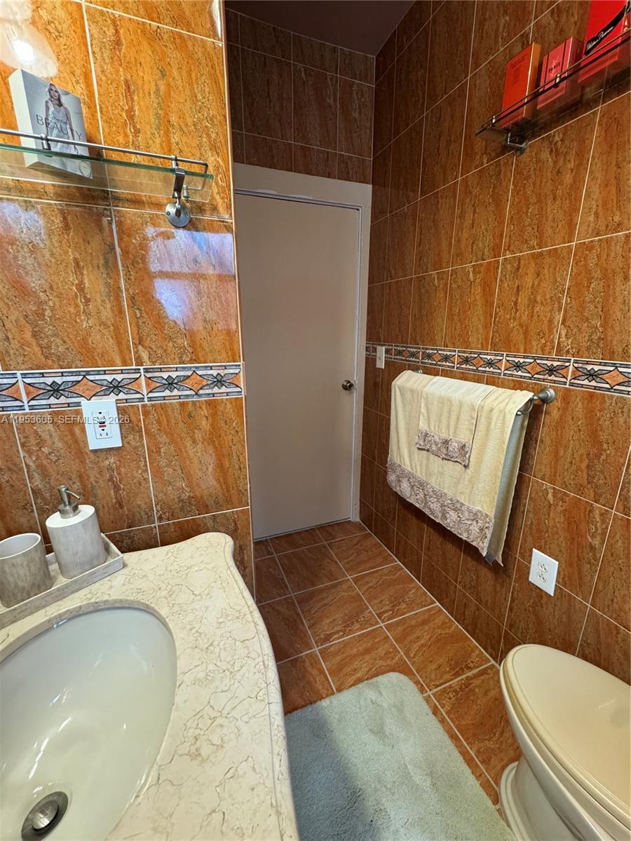 322 Southwest 31st Court Miami, FL 33135 - Photo 13 of 21 a bathroom with a sink and toilet