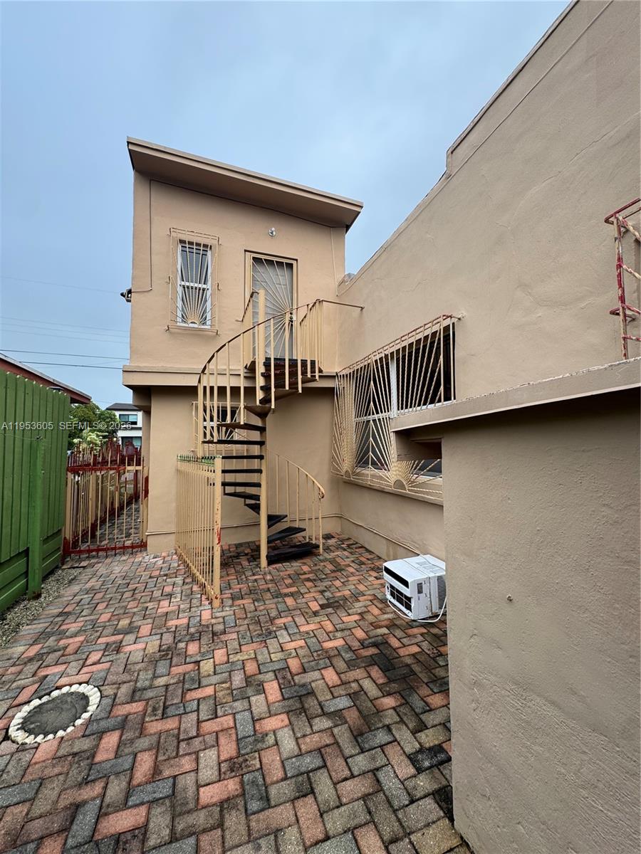 322 Southwest 31st Court Miami, FL 33135 - Photo 15 of 21 a backyard of a house with barbeque oven table and chairs