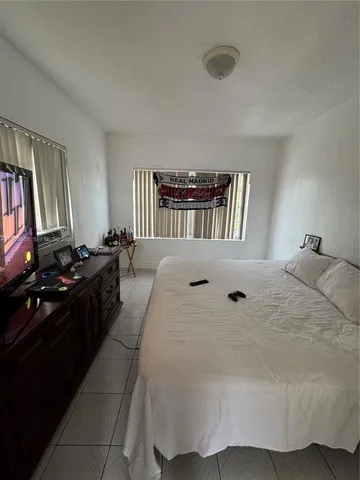 a bathroom with a toilet sink and shower