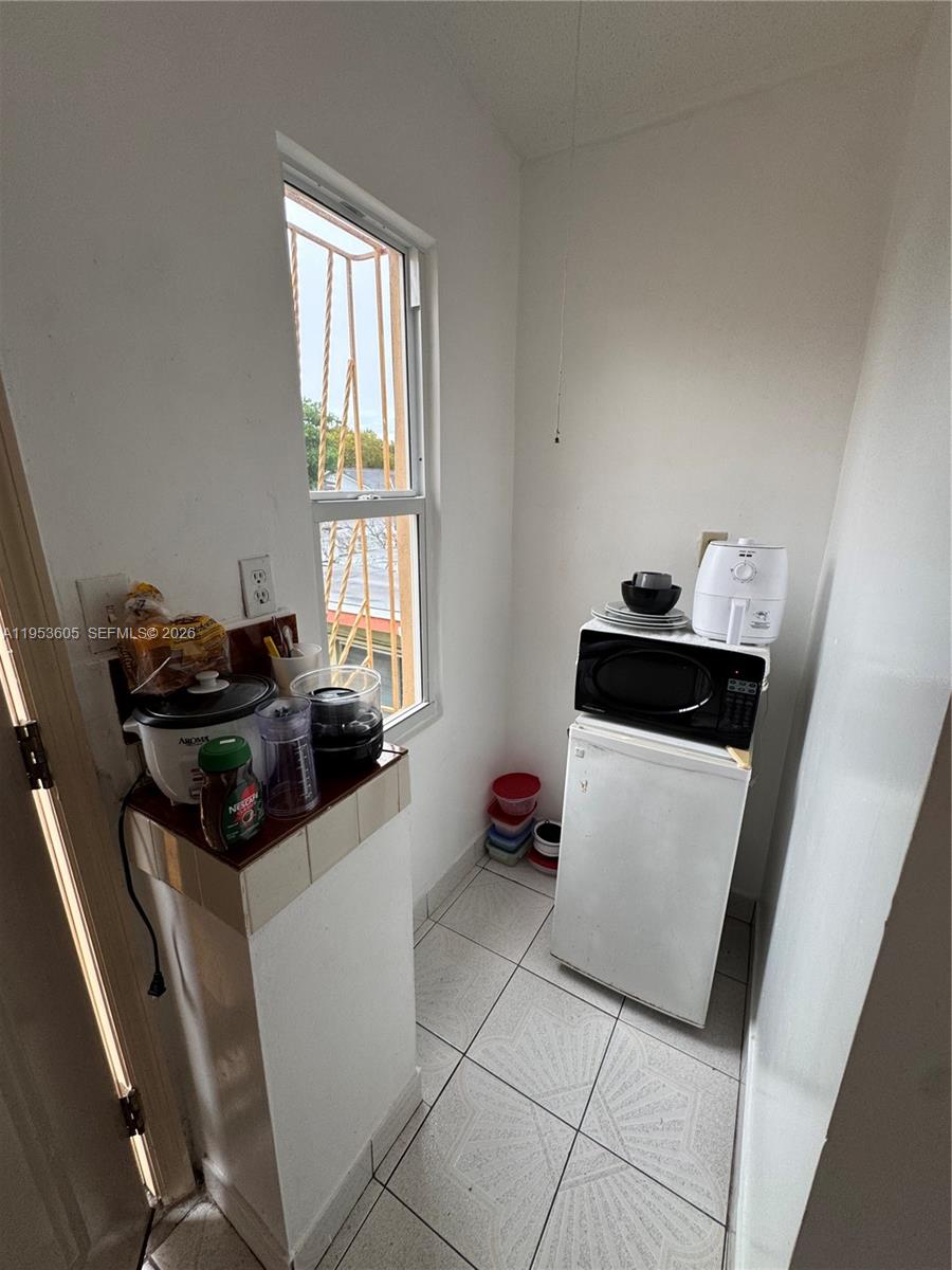 322 Southwest 31st Court Miami, FL 33135 - Photo 17 of 21 a room with storage and utility