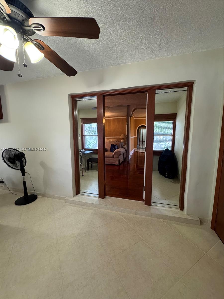 322 Southwest 31st Court Miami, FL 33135 - Photo 2 of 21 a room with furniture and a chandelier