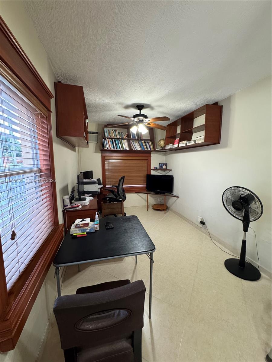 322 Southwest 31st Court Miami, FL 33135 - Photo 3 of 21 a room with furniture and gym equipment