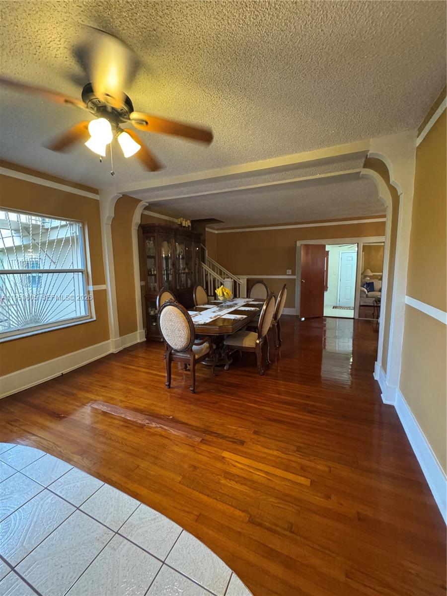 322 Southwest 31st Court Miami, FL 33135 - Photo 6 of 21 a living room with furniture and wooden floor