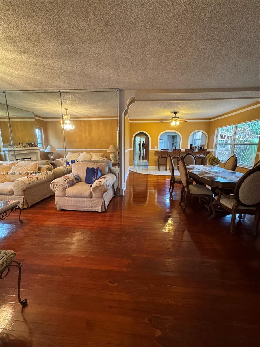 322 Southwest 31st Court Miami, FL 33135 - Photo 7 of 21 a living room with furniture and a large window