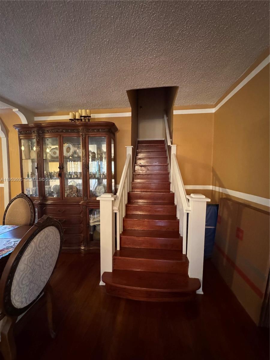 322 Southwest 31st Court Miami, FL 33135 - Photo 8 of 21 a view of entryway and hall with wooden floor