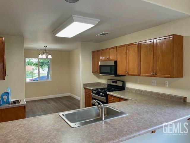 Undisclosed Address Bakersfield, CA 93313 - Photo 3 of 11 a room with furniture and a flat screen tv