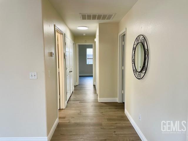 Undisclosed Address Bakersfield, CA 93313 - Photo 4 of 11 a view of an entryway with wooden floor