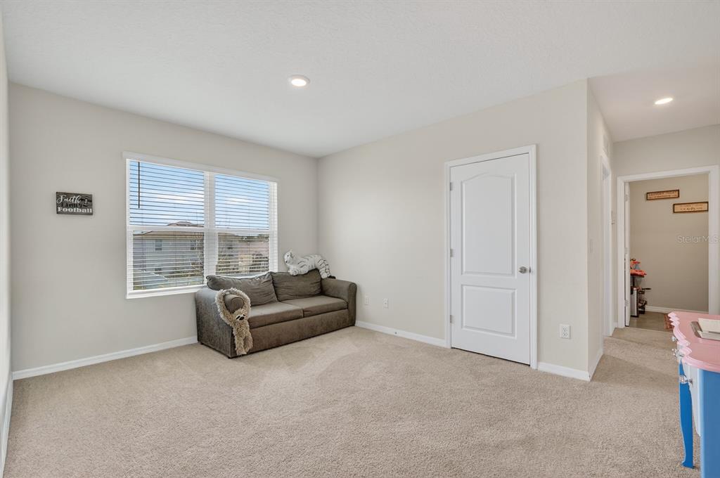1809 Myrtlebrooke Drive Edgewater, FL 32141 - Photo 24 of 58 a living room with furniture and a window