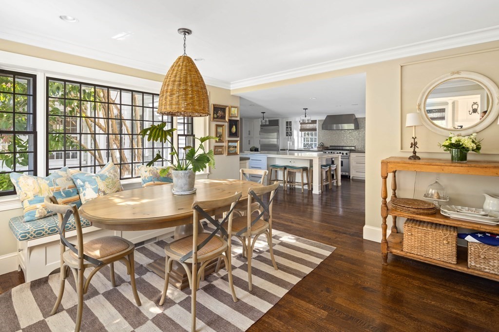 346 Main Street Hingham, MA 02043 - Photo 11 of 42 a dining room with wooden floor a chandelier a wooden table and chairs