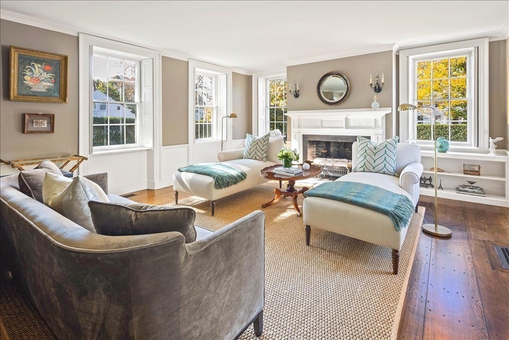 346 Main Street Hingham, MA 02043 - Photo 20 of 42 a living room with furniture a large window and a fireplace