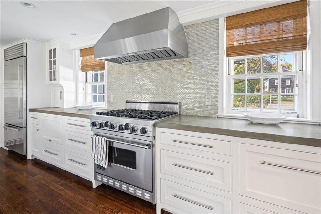 346 Main Street Hingham, MA 02043 - Photo 9 of 42 a kitchen with granite countertop white cabinets and a stove