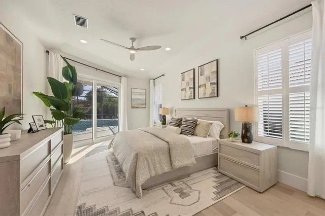 an empty room with a ceiling fan and a window