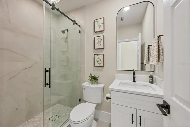 an aerial view of a houses with a yard