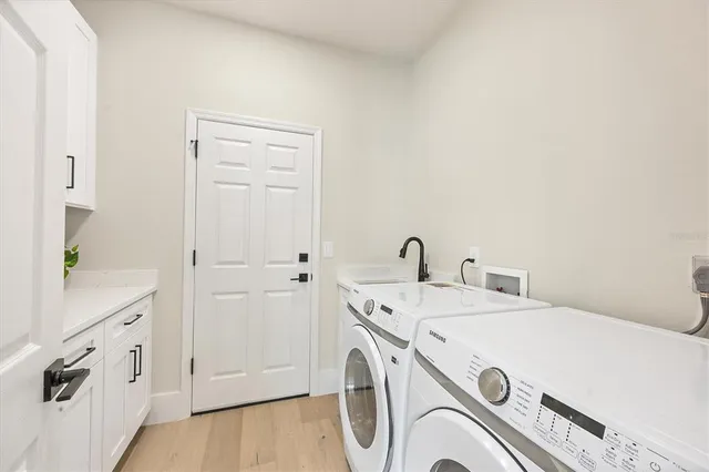 an aerial view of a houses with a lake view