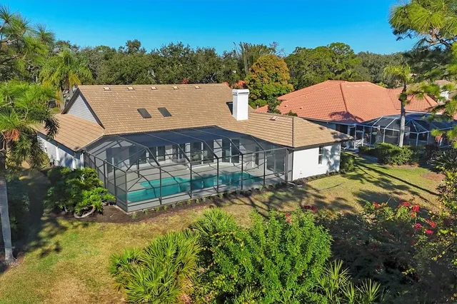 a living room with furniture a wooden floor and a fireplace
