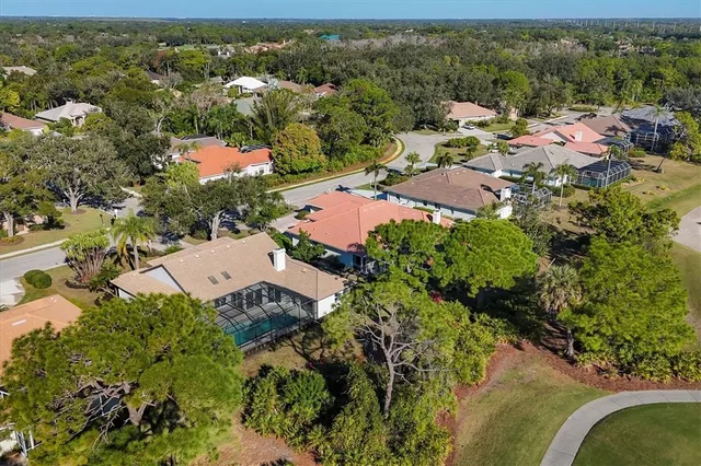 a living room with lots of furniture and a large window