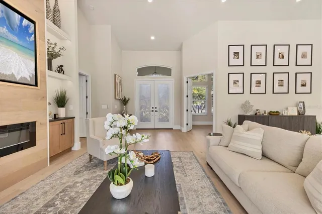 a dining room with furniture a chandelier and livingroom view
