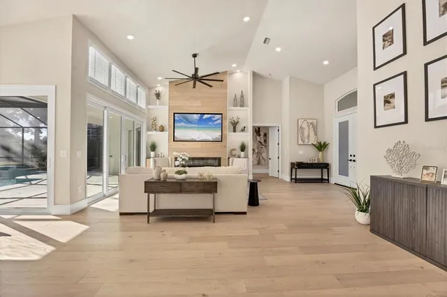 a view of a dining room with furniture wooden floor and chandelier
