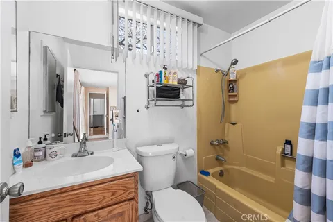 a bathroom with a sink a mirror and a shower