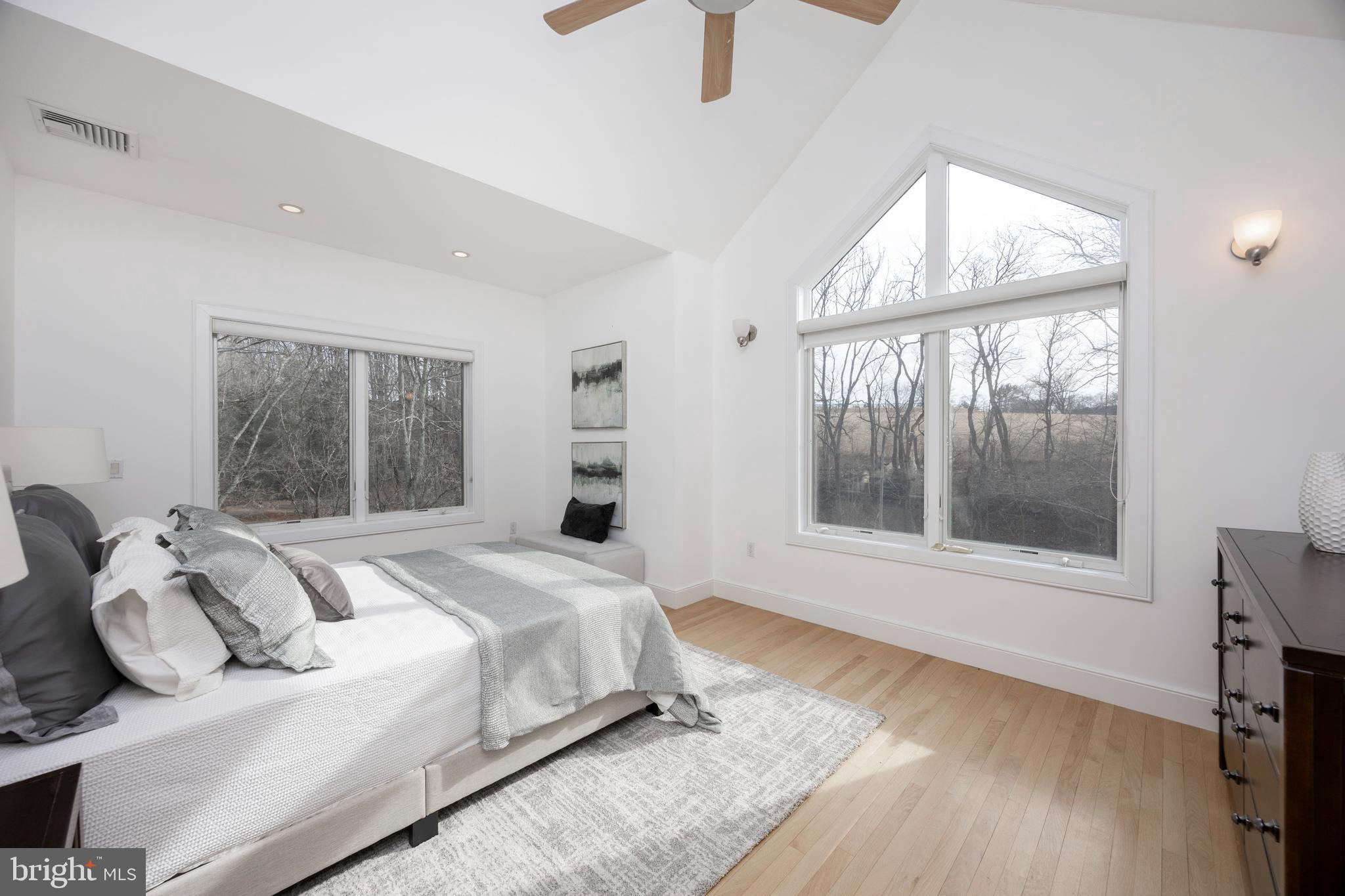 115 Bullock Road Chadds Ford, PA 19317 - Photo 30 of 50 a bedroom with a bed and a large window