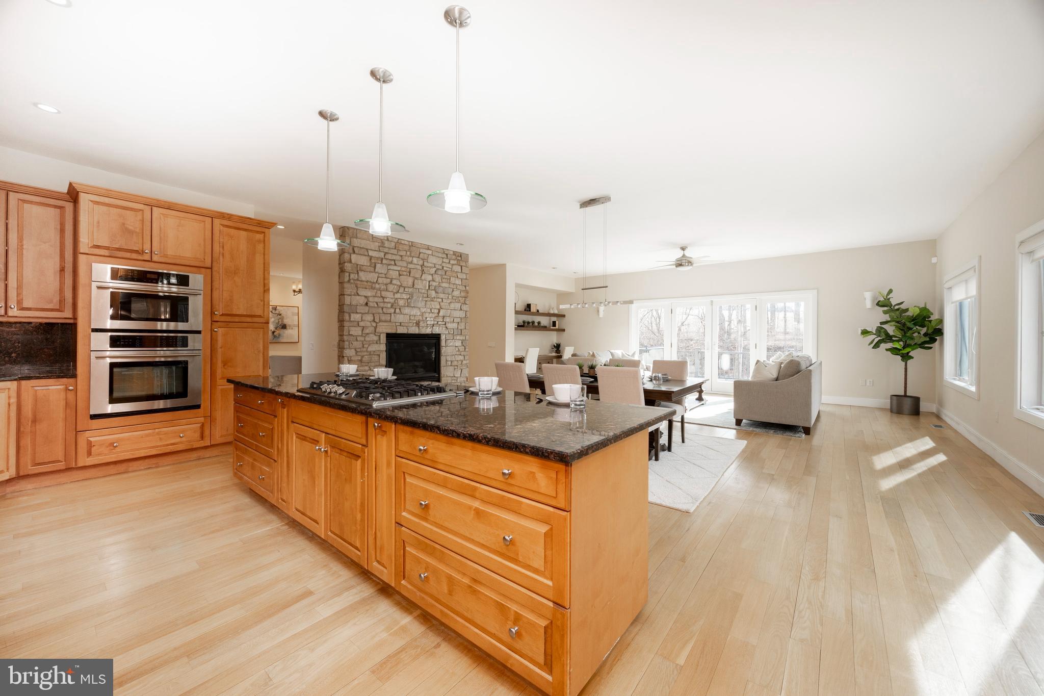 115 Bullock Road Chadds Ford, PA 19317 - Photo 3 of 50 a large kitchen with stainless steel appliances granite countertop a stove and a wooden floors