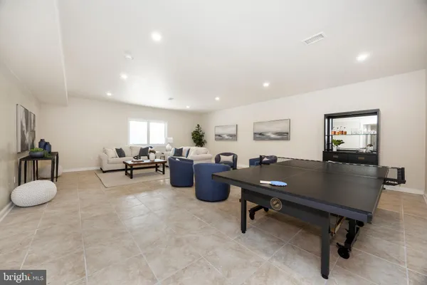 a living room with furniture and a rug