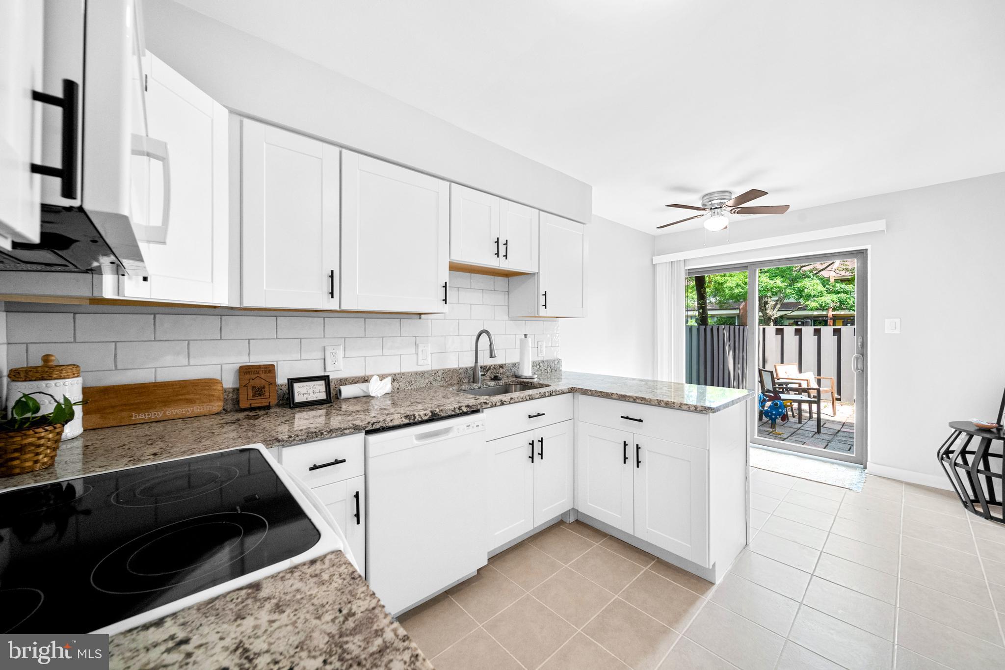 1386 Northgate Square Reston, VA 20190 - Photo 6 of 39 White cabinets and new appliances