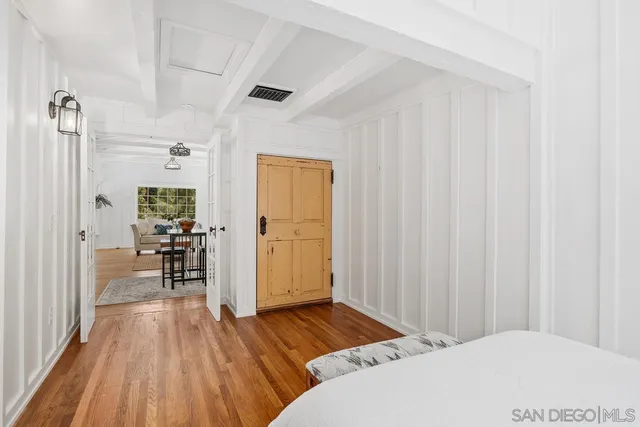 a bedroom with a bed and a table