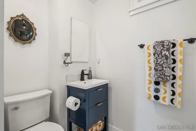 a bathroom with a toilet and a sink