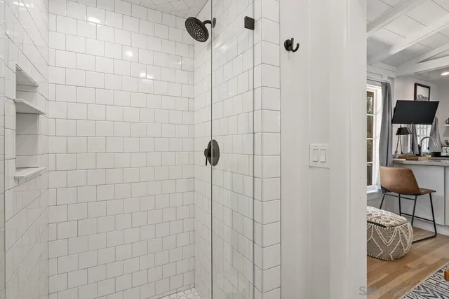 a bathroom with a bathtub and a shower
