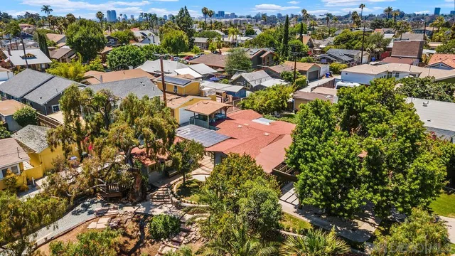 a garden with trees in front of it