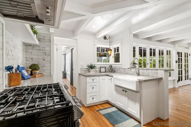 a kitchen with stainless steel appliances granite countertop a stove and a sink