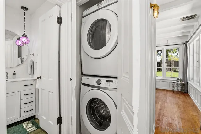 a view of a hallway with washer and dryer