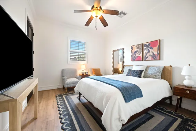 a bed room with bed and a chandelier