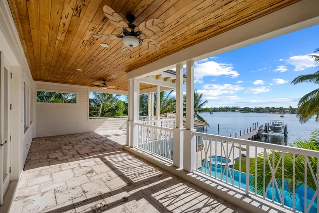 a view of a balcony with wooden floor