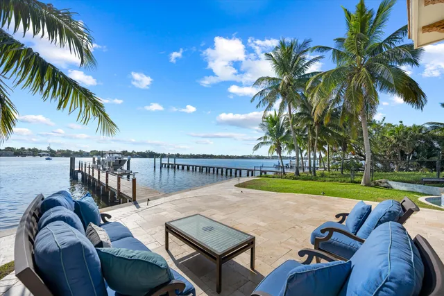 a view of swimming pool with outdoor seating and plants
