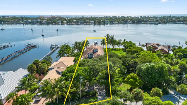 a view of a lake with houses in the back