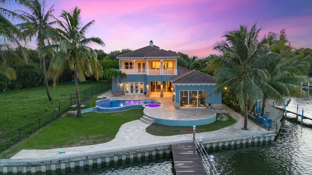 a house with swimming pool and garden