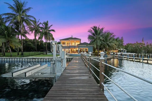 a house with swimming pool in front of it