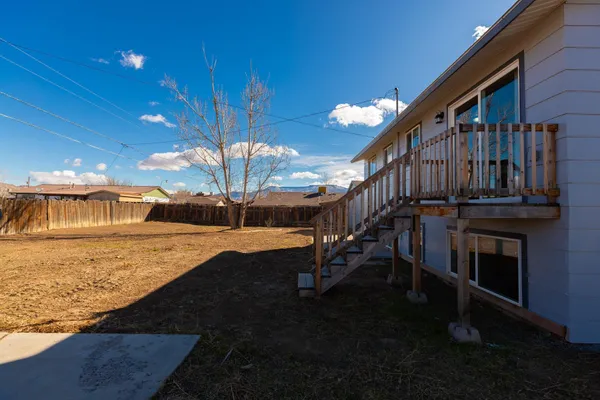 a view of a backyard of the house