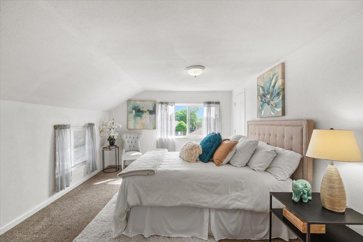 572 Pedersen Road Oakdale, CA 95361 - Photo 27 of 36 a bedroom with a large bed and a window