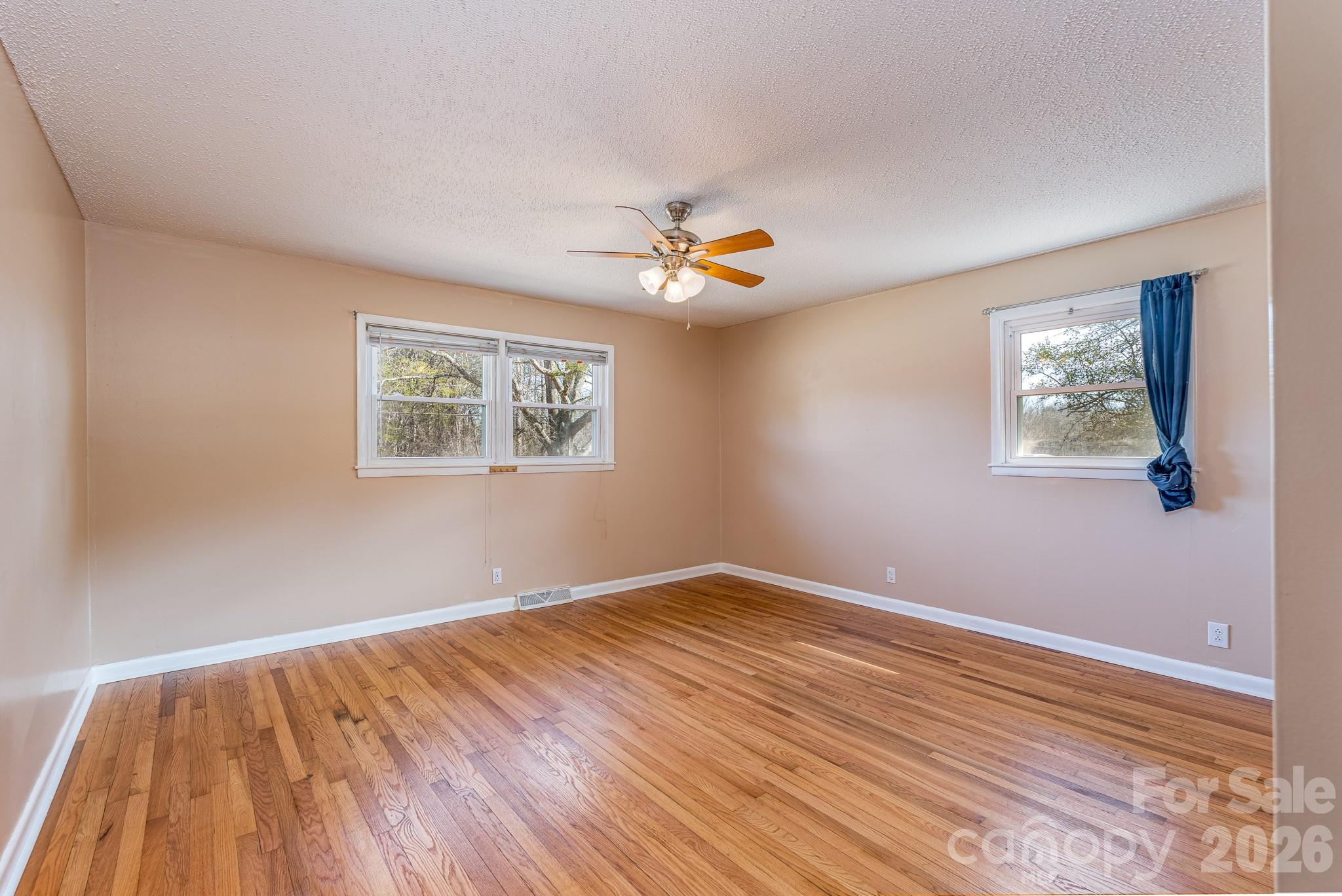 3439 Filbert Highway Clover, SC 29710 - Photo 17 of 28 a view of an empty room with wooden floor and a window