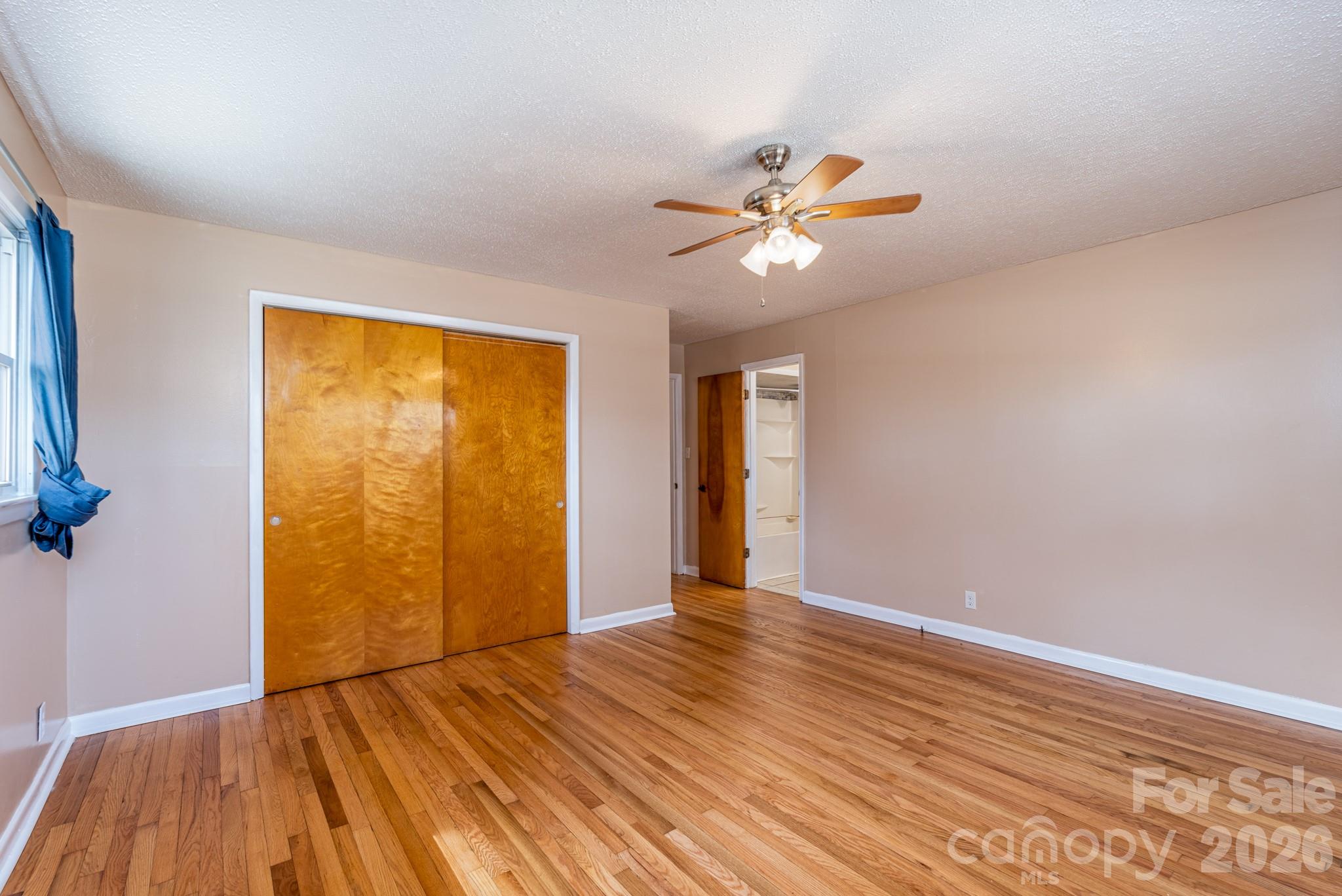 3439 Filbert Highway Clover, SC 29710 - Photo 18 of 28 a view of an empty room with wooden floor and a window