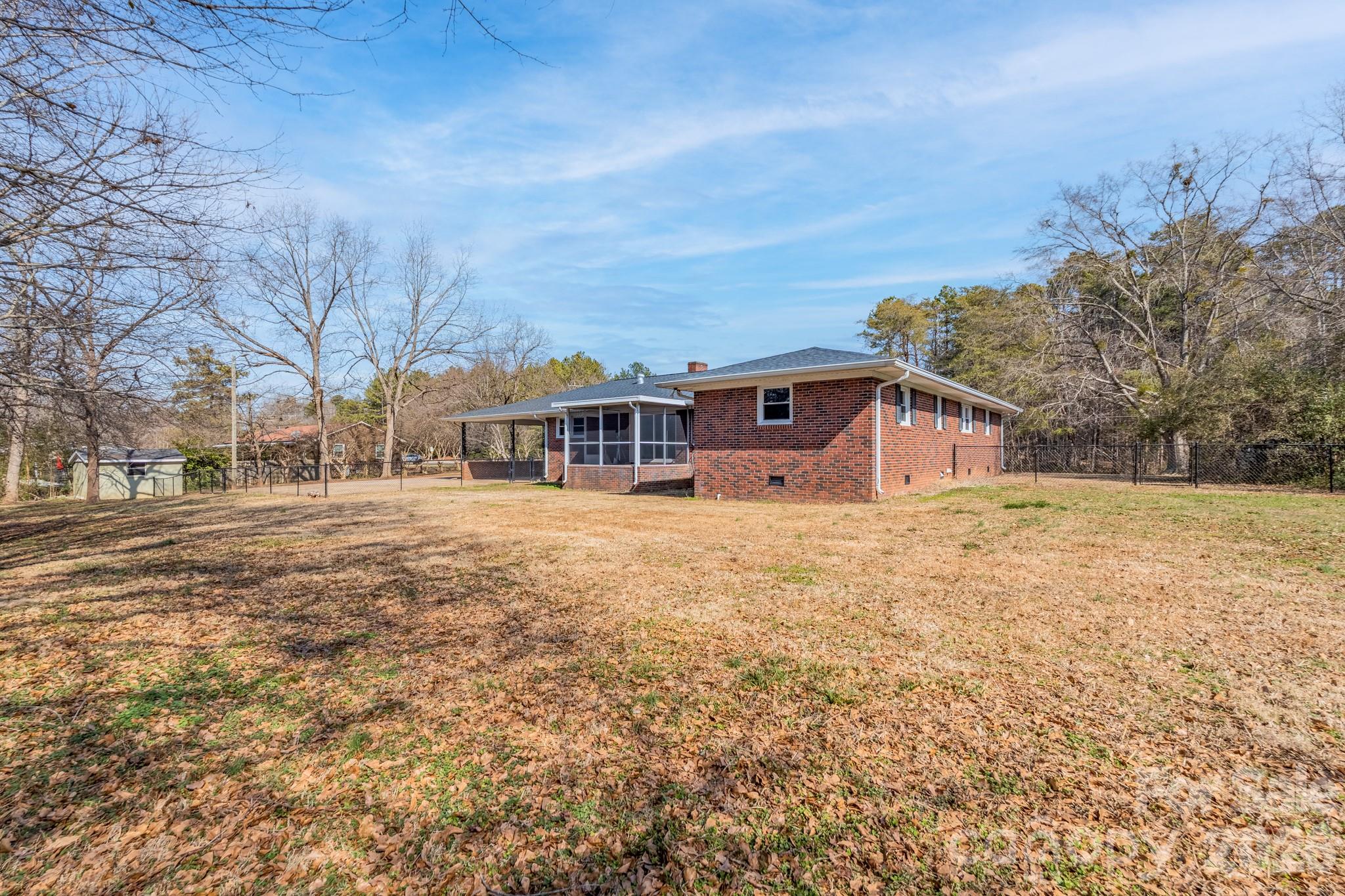 3439 Filbert Highway Clover, SC 29710 - Photo 25 of 28 a view of house with yard and trees in the background