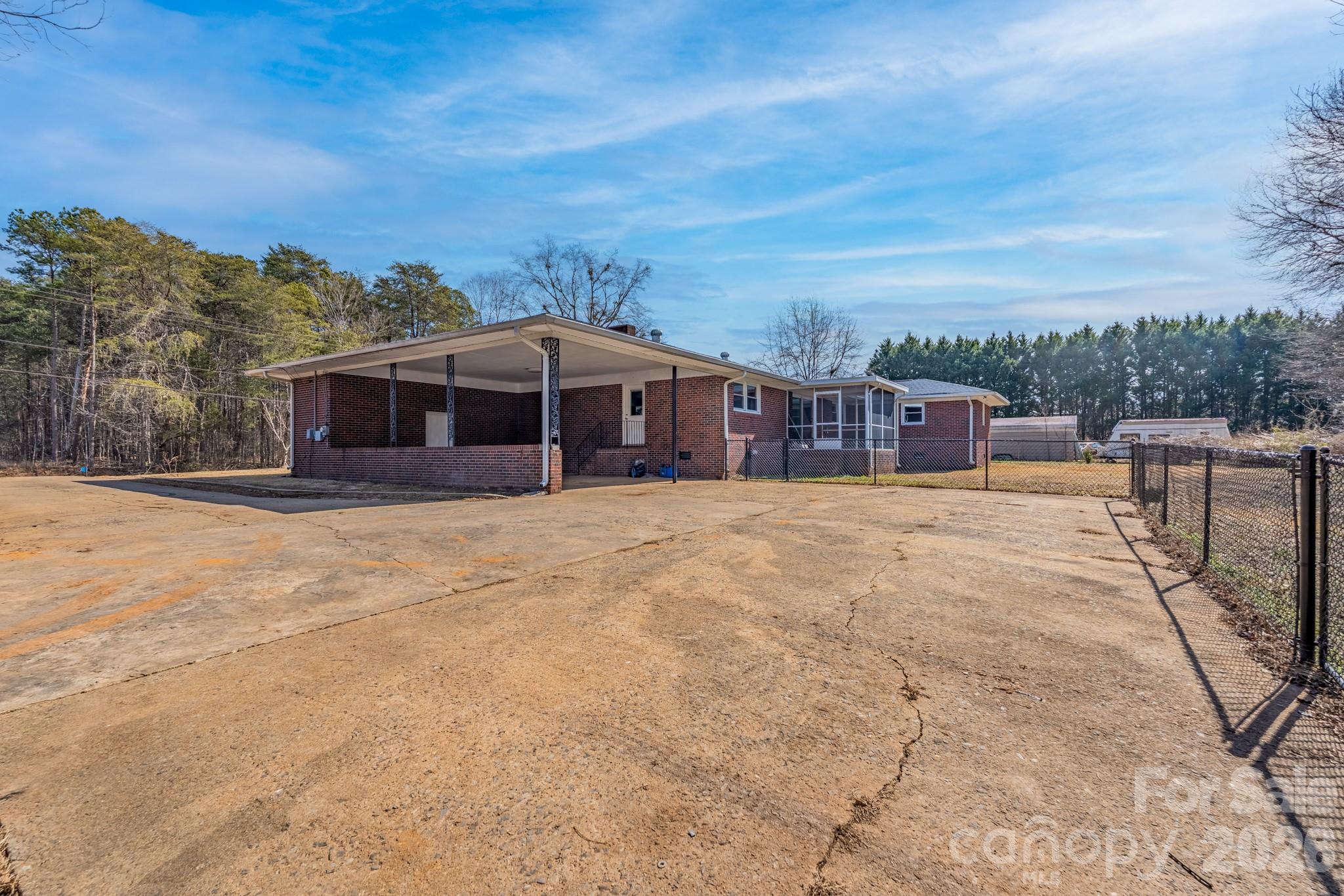 3439 Filbert Highway Clover, SC 29710 - Photo 4 of 28 a view of a house with a wooden fence