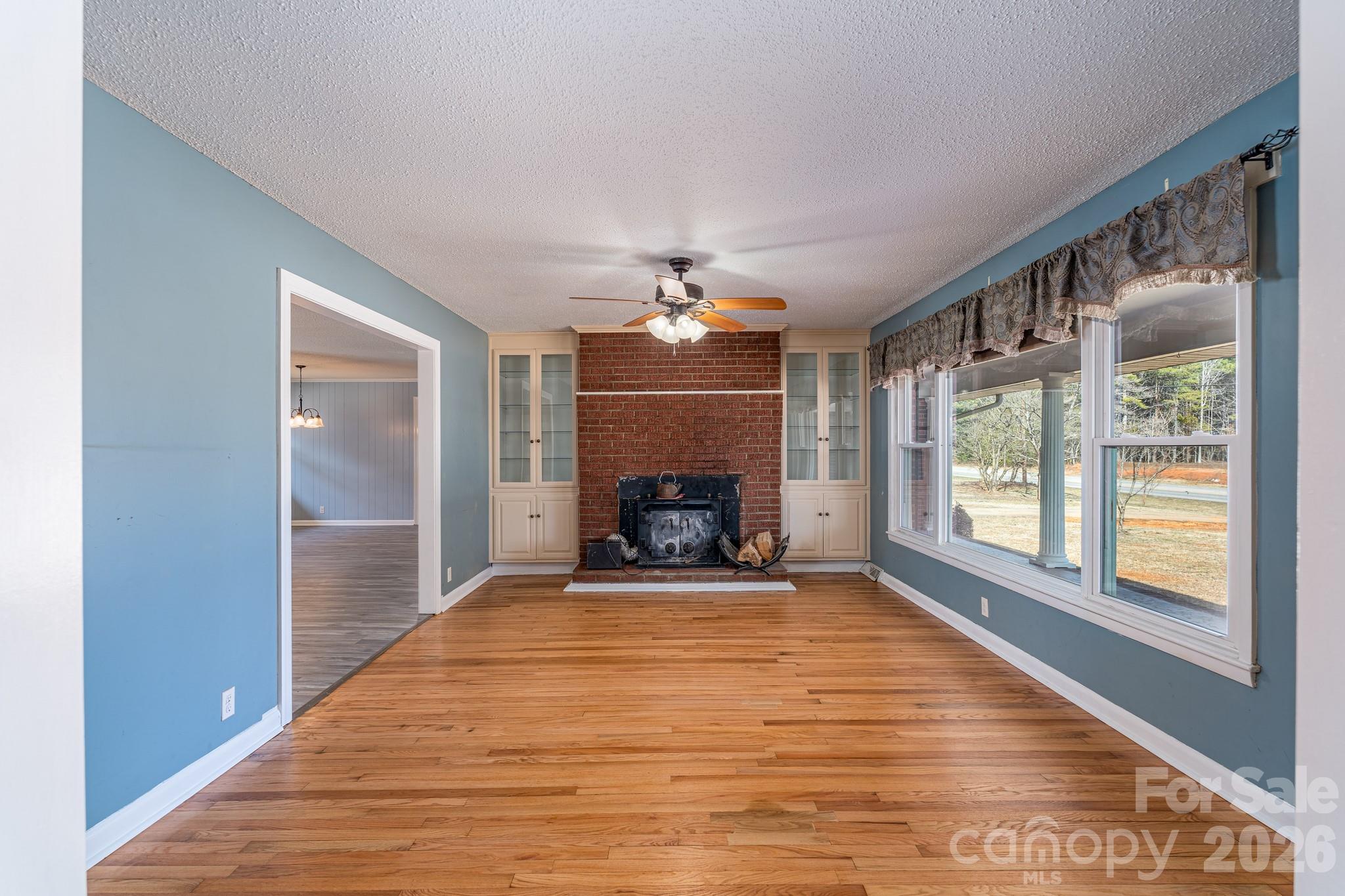 3439 Filbert Highway Clover, SC 29710 - Photo 8 of 28 a view of a livingroom with an empty space and a fireplace